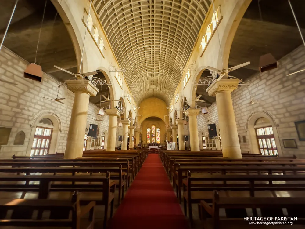 Angled nave view of Holy Trinity Church showing side aisle windows and arcades