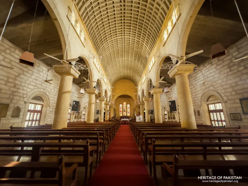 Angled nave view of Holy Trinity Church showing side aisle windows and arcades