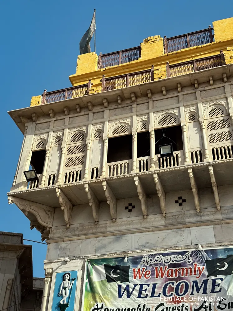 Detail of the carved marble balcony tier on Sadhu Belo Temple's tower