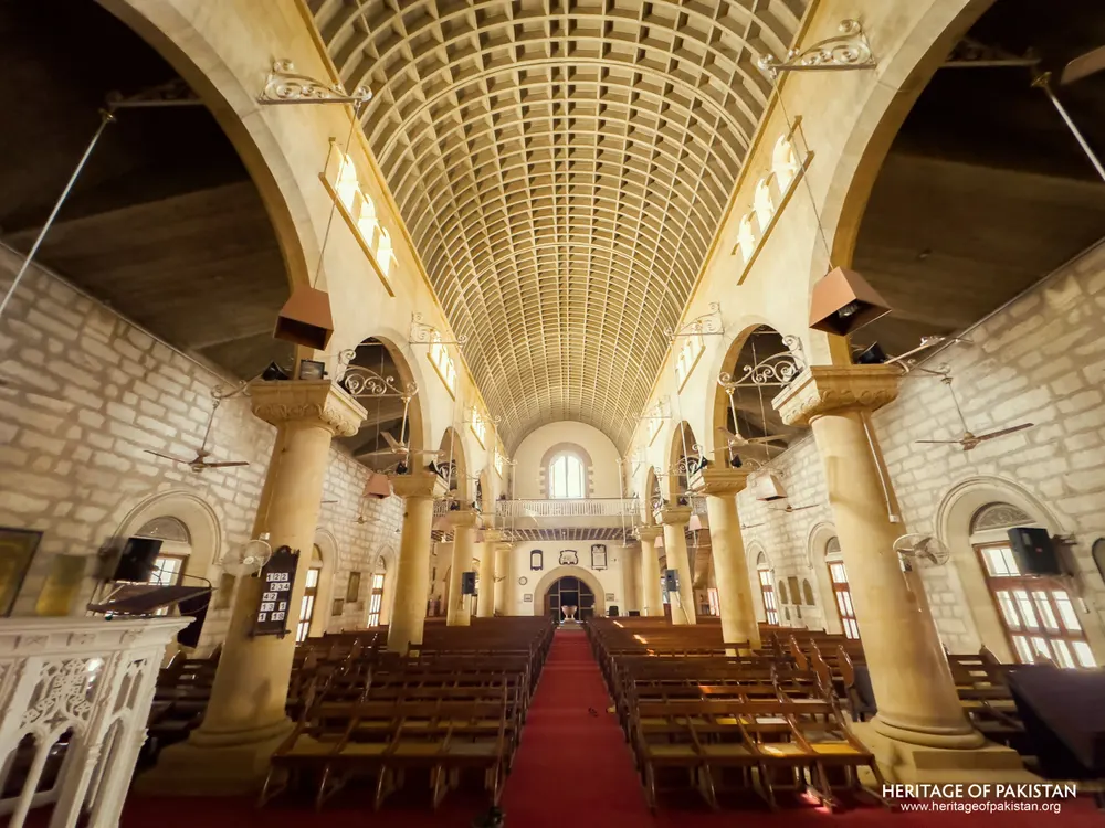 Wide nave view of Holy Trinity Church from the chancel showing the organ loft gallery