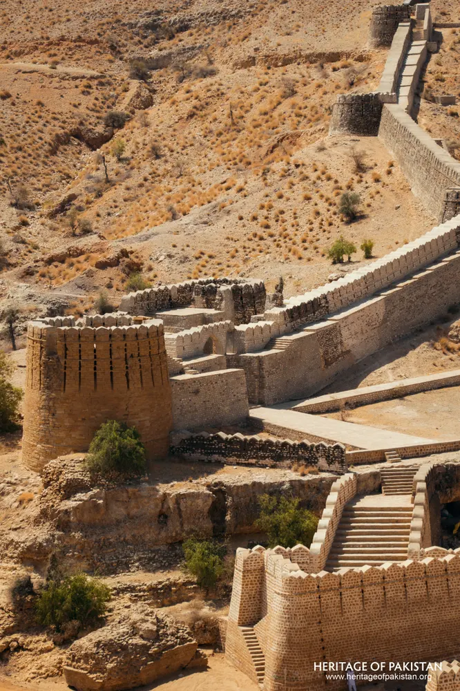 Aerial view of a rubble stone wall with a square bastion