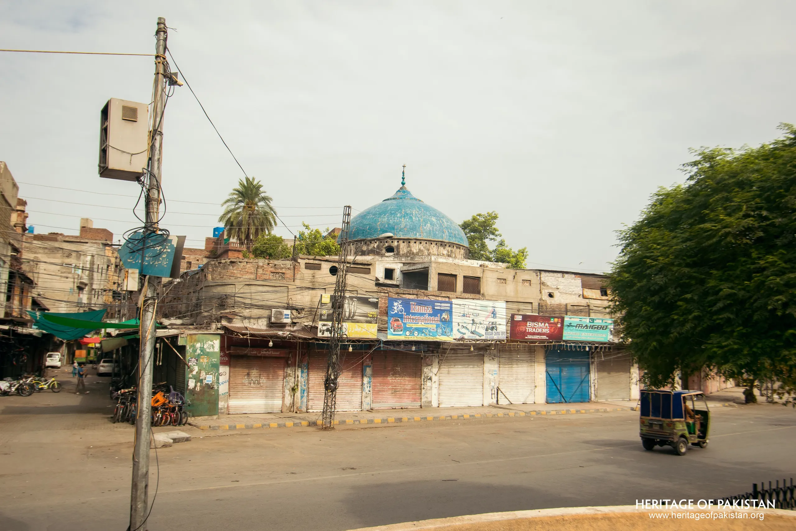 On Mall Road in Lahore, near Anarkali Bazaar, a turquoise dome rises above a cycle market.