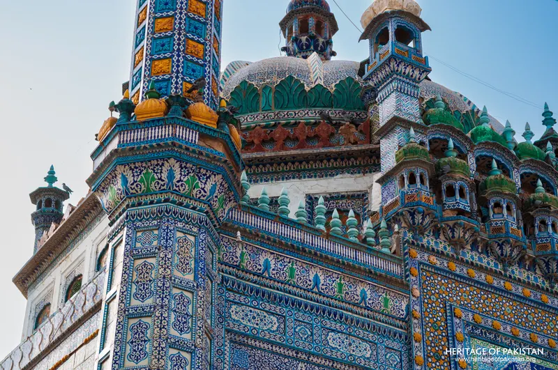 Green-glazed domes and tiled turrets crowning the shrine