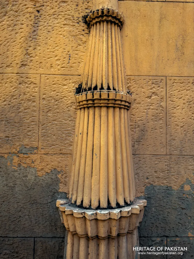 Close-up of a fluted column shaft with ringed collars