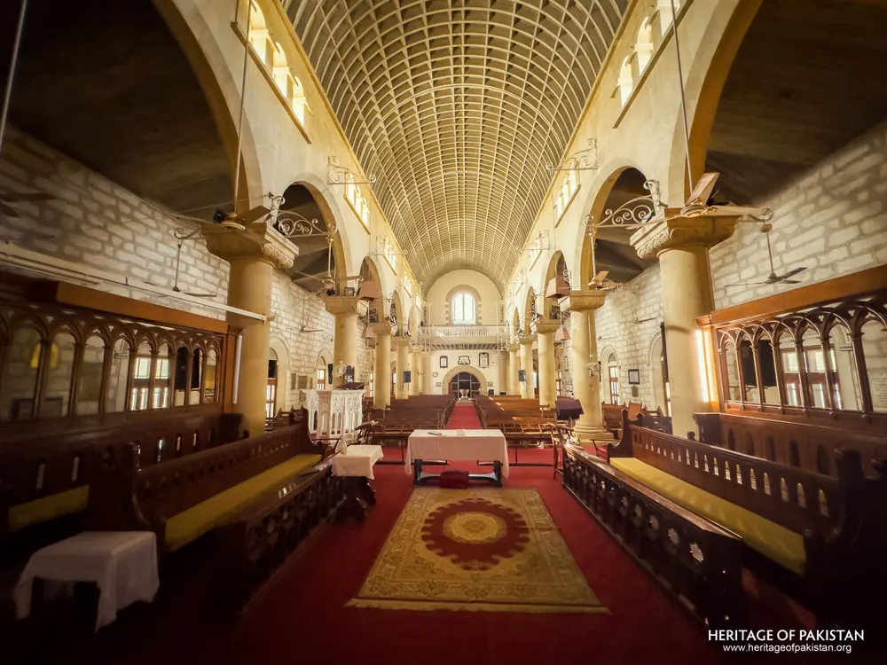 View from the chancel back down the nave of Holy Trinity Church over a patterned rug