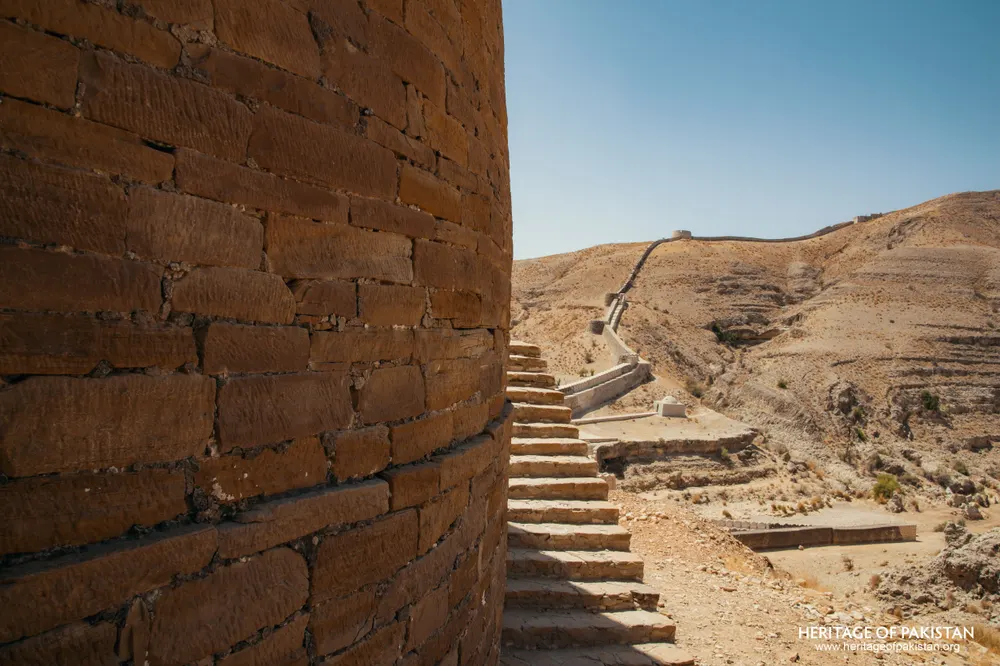 Brick bastion wall beside a stone staircase
