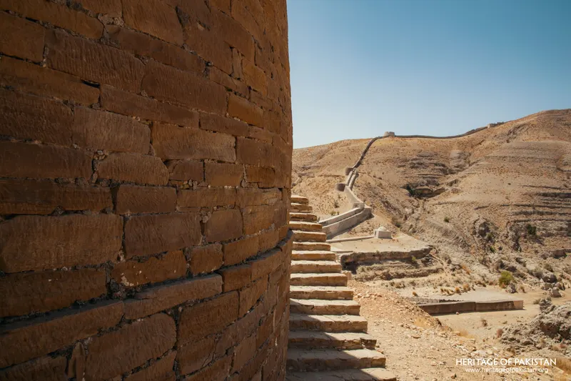 Brick bastion wall beside a stone staircase