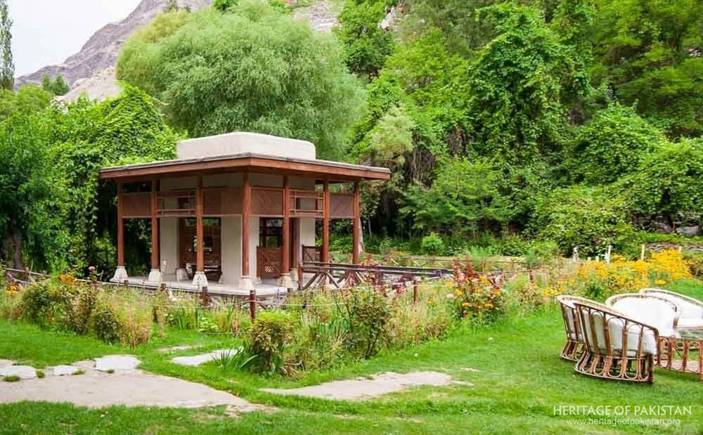 Shigar Fort's garden pavilion nestles among flowering beds and poplar trees.