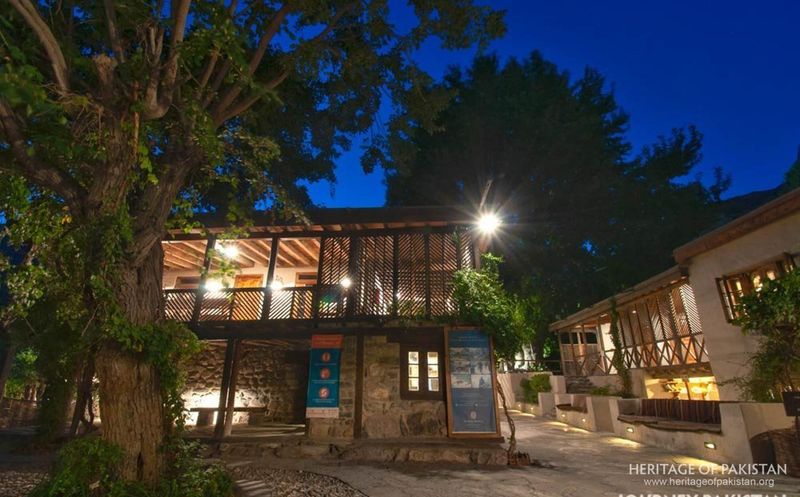 Shigar Fort's restored structures glow warmly into the evening.