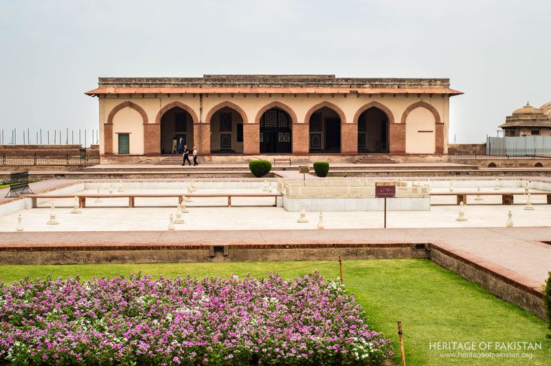 Purple flowering beds frame the main facade at Jahangir's Quadrangle