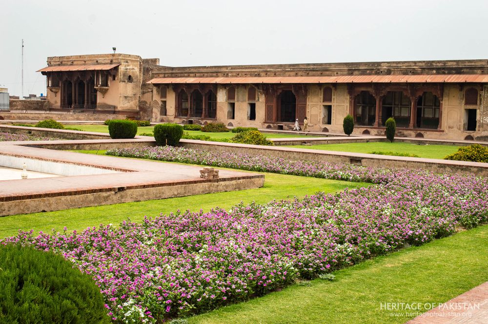Purple blooms fill garden beds within the expansive quadrangle courtyard
